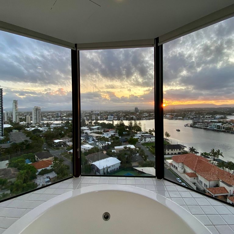 fancy house looking at water with tinted windows